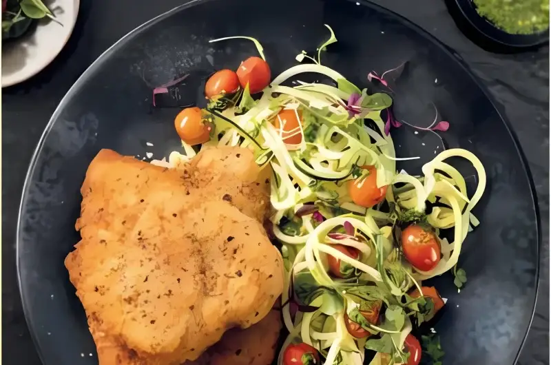 If you’re craving a dish that brings together golden comfort food with fresh Mediterranean flavors, look no further than this Crispy Chicken Schnitzel with Basil Pesto Zucchini Noodles. Perfectly crunchy chicken pairs with refreshing zucchini noodles tossed in homemade basil pesto — a combination that’s light, healthy, and satisfying.This recipe is quick enough for busy weeknights yet impressive enough for dinner guests. Low in carbs, high in flavor, and full of nourishing ingredients, it’s one of those meals you’ll come back to again and again.